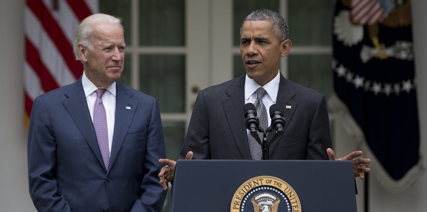 President Barack Obama, joined by Vice President Joe Biden, speaks in the Rose Garden of the White House, Thursday, June 25, 2015, in Washington, about that the U.S. Supreme Court upheld the subsidies for customers in states that do not operate their own exchanges under President Barack Obama's Affordable Care Act. (AP Photo/Carolyn Kaster) ORG XMIT: MIN2015062514301041