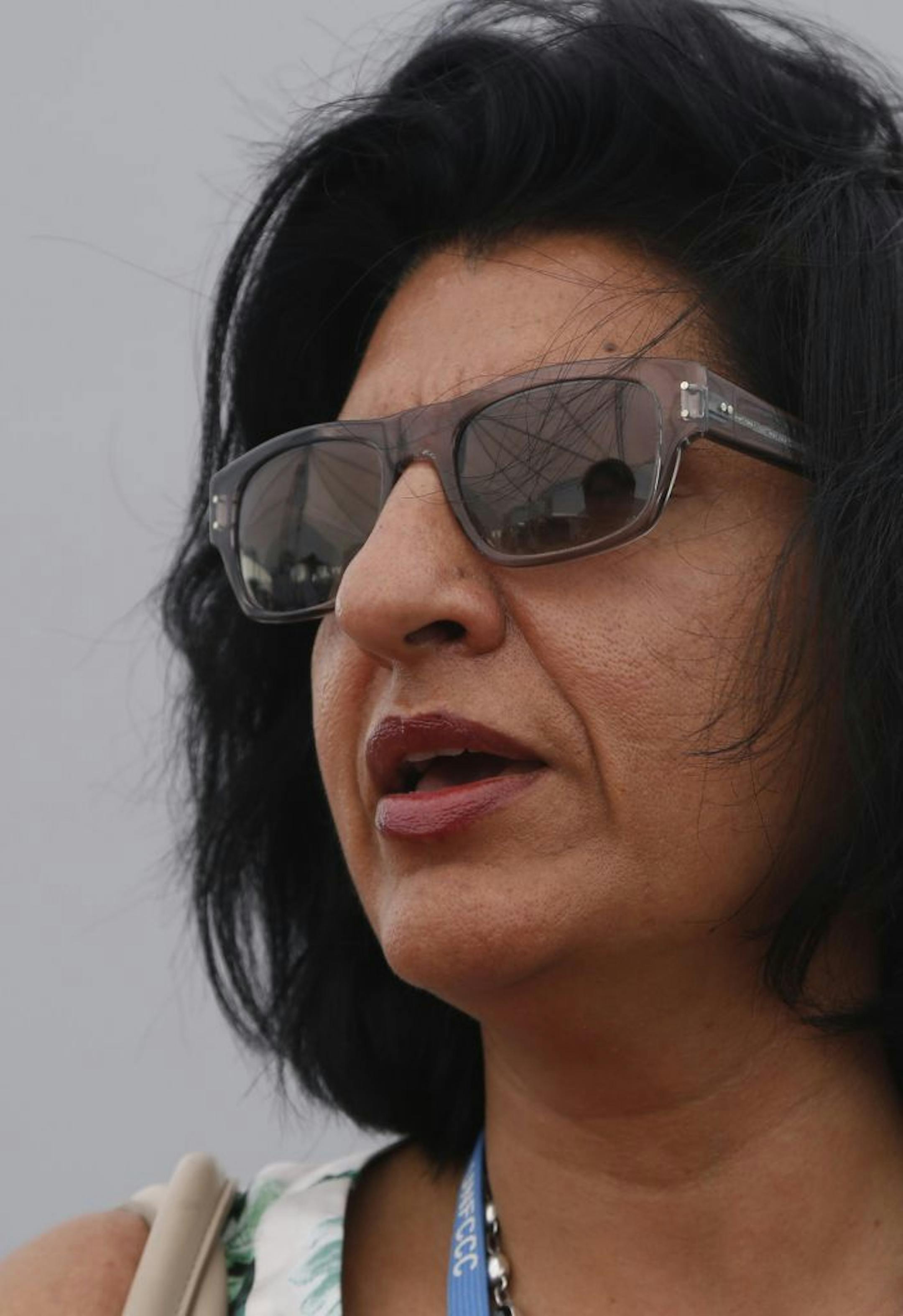 Farhana Yamin, London-based environmental lawyer who is an adviser for the Marshall Islands, speaks with the Associated Press during the Climate Change Conference in Lima, Peru, Tuesday, Dec. 9, 2014. Farhana pointed out a paragraph in a copy of the 1992 U.N. climate change convention that states the goal: To stabilize greenhouse gas concentrations at a level that would prevent dangerous warming. "In your lifetime, emissions have to go to zero. That's a message people understand," said the Pakis