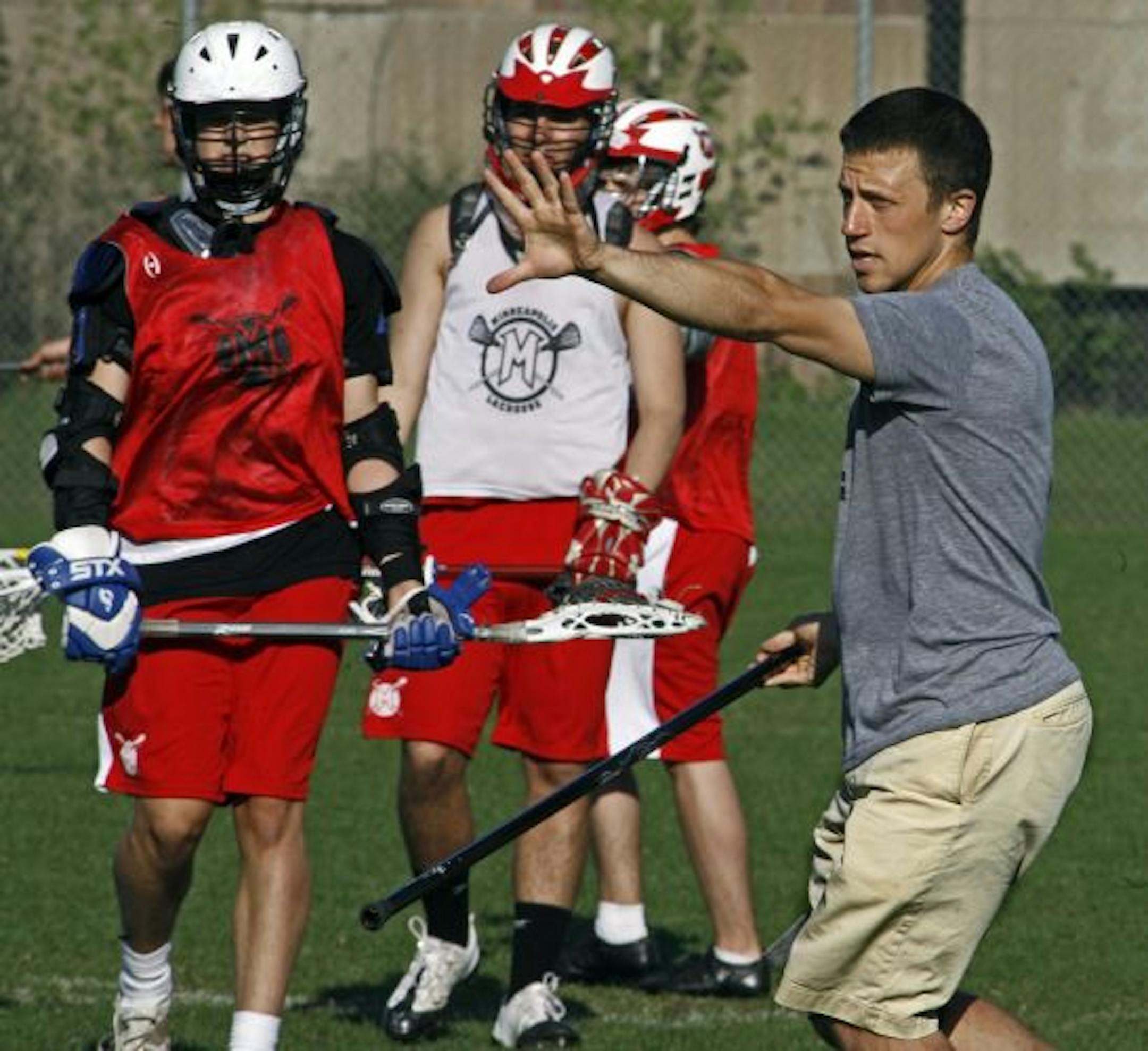 Aron Lipkin coached the lacrosse team during a recent practice session.