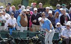 Amateur Sammy Schmitz hits to the ninth green during the first round of the Masters golf tournament Thursday, April 7, 2016, in Augusta, Ga. (AP Photo