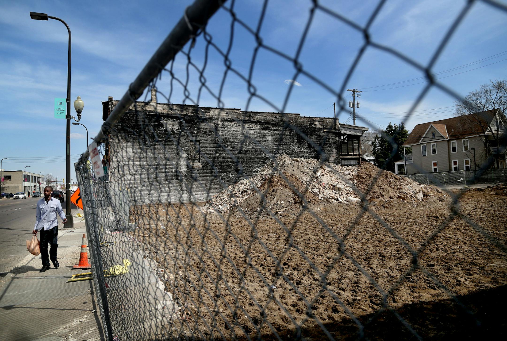 Rubble from former buildings destroyed in the fire is still visible Friday, April 15, 2016, in Minneapolis, MN.](DAVID JOLES/STARTRIBUNE)djoles@startribune.com One year after the fire that ripped through West Broadway's few remaining historic properties, the buildings have been demolished and property owners say it has been a struggle to rebound.