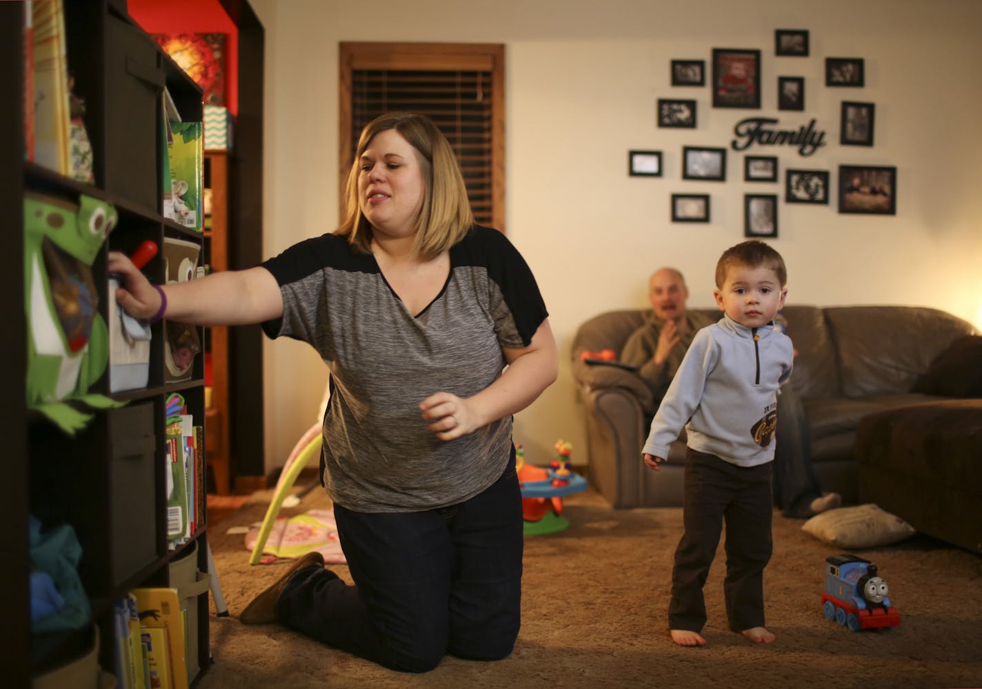 Jamie Ward and her husband, Wesley, are trying to decide whether to buy insurance on MNsure and give up some comforts or forgo coverage for themselves and take the risk they will get through the year healthy and pay out of pocket for medical needs. Their two young kids are covered by Medical Assistance, but the parents do not qualify for public programs or for subsidies to lower premiums. Jamie Ward with her son, Colton, 2, and husband, Wesley, who was holding their daughter, Keira, 5 months Wed