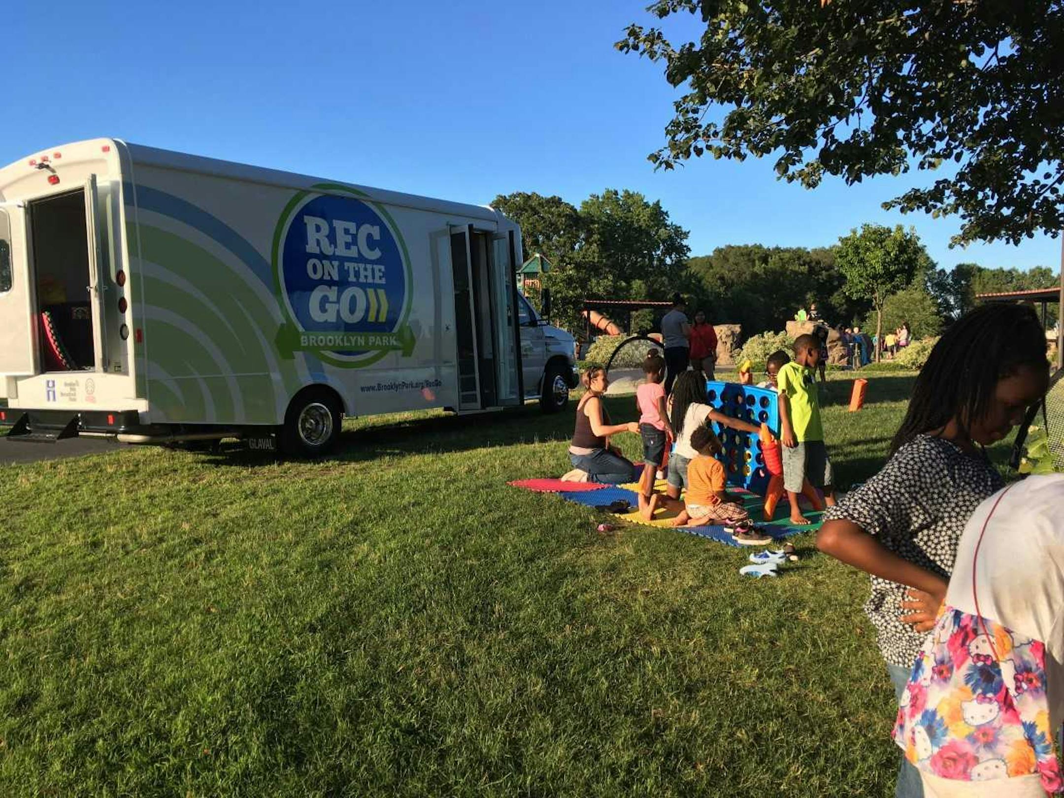 Kids play games in front of a Rec on the Go van in Brooklyn Park. (Courtesy of Pam McBride)