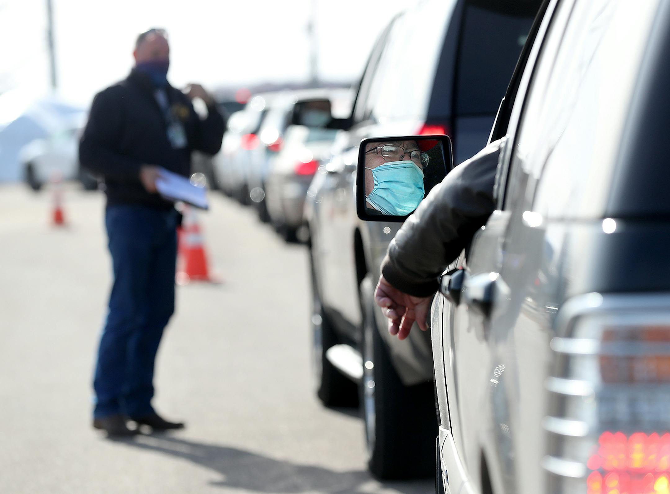 Brian Johnson of Eau Claire waited in his car at the free COVID-19 testing site staffed by the Wisconsin National Guard Monday in Eau Claire, WI.