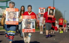 Ana Negrete, interim director for Minnesota's Missing and Murdered Indigenous Relatives Office, center, walks alongside Juliet Rudie and members of th
