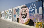 A wall mural displays the "2030 Vision" logo and Saudi Arabia's Crown Prince Mohammed bin Salman in Dhahran, Saudi Arabia, on Oct. 4, 2018. MUST CREDI
