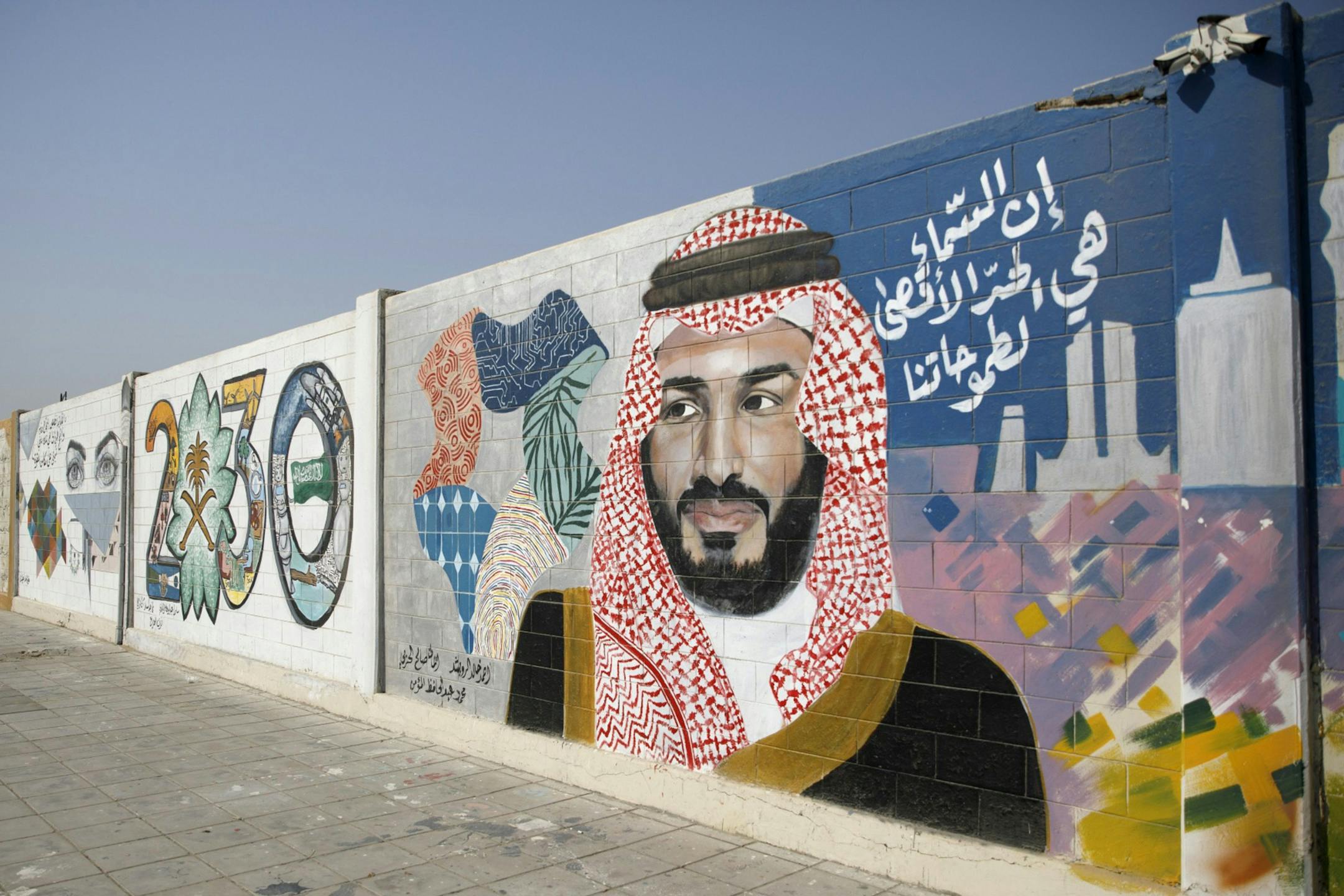 A wall mural displays the "2030 Vision" logo and Saudi Arabia's Crown Prince Mohammed bin Salman in Dhahran, Saudi Arabia, on Oct. 4, 2018. MUST CREDIT: Bloomberg photo by Simon Dawson ORG XMIT: 775241275