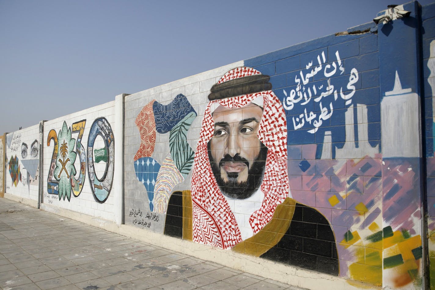 A wall mural displays the "2030 Vision" logo and Saudi Arabia's Crown Prince Mohammed bin Salman in Dhahran, Saudi Arabia, on Oct. 4, 2018. MUST CREDIT: Bloomberg photo by Simon Dawson ORG XMIT: 775241275