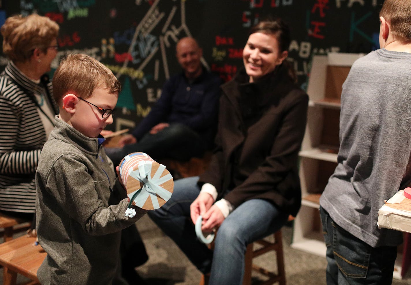 Carter Chabot, 6, of Plymouth admired his creation as his mom Melissa looked on. ] ANTHONY SOUFFLE &#xef; anthony.souffle@startribune.com Visitors created art in the Cardboard Engineering gallery Saturday, Jan. 17, 2018 at the Science Museum of Minnesota in St. Paul. The museum is working to highlight exhibits curated by its own staff and creating more community events.