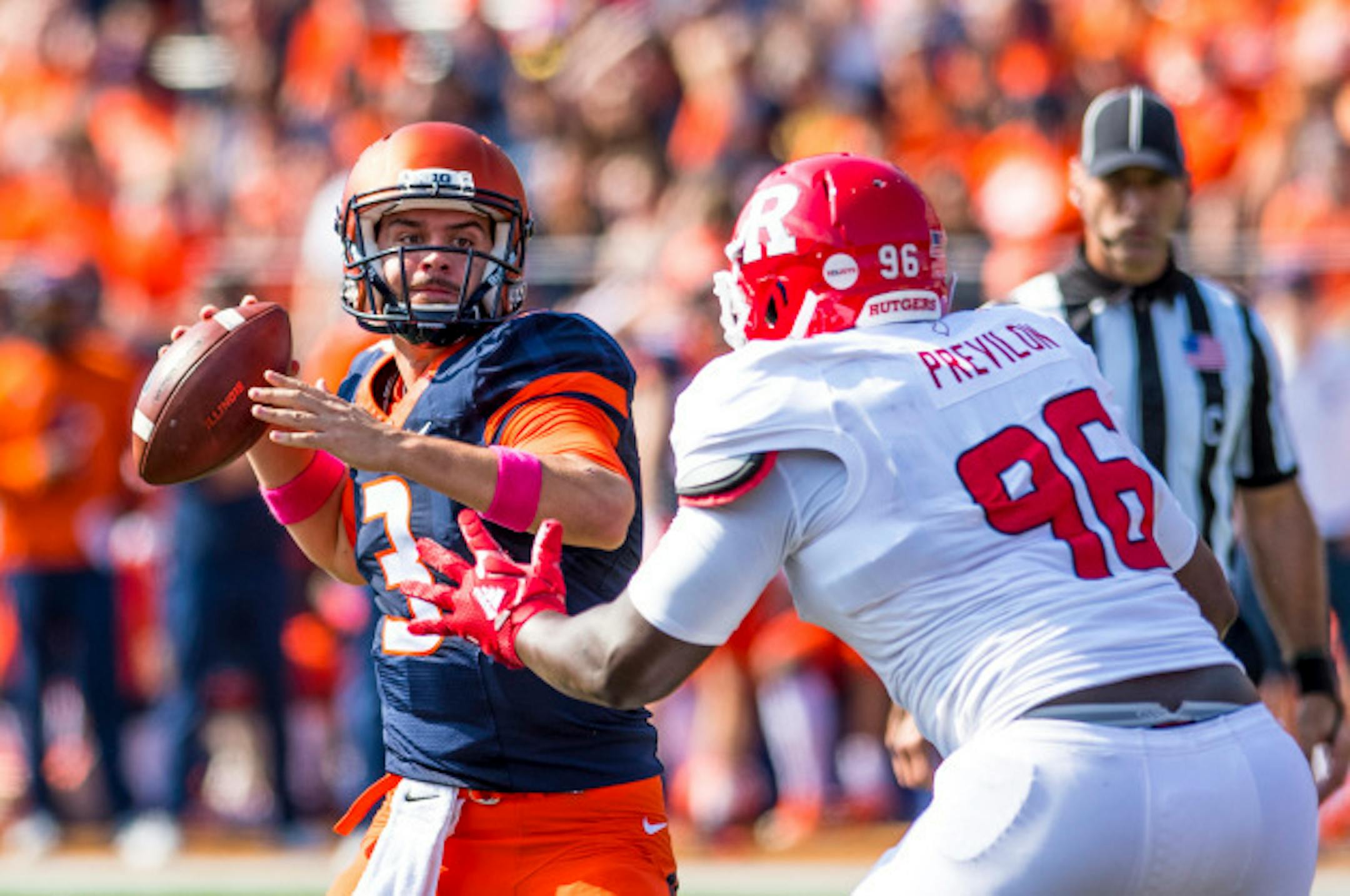 Illinois quarterback Jeff George Jr. (3) throws the ball while under pressure from Rutgers defensive lineman Willington Previlon (96) during the first quarter of an NCAA college football game Saturday, Oct. 14, 2017, at Memorial Stadium in Champaign, Ill. (AP Photo/Bradley Leeb)