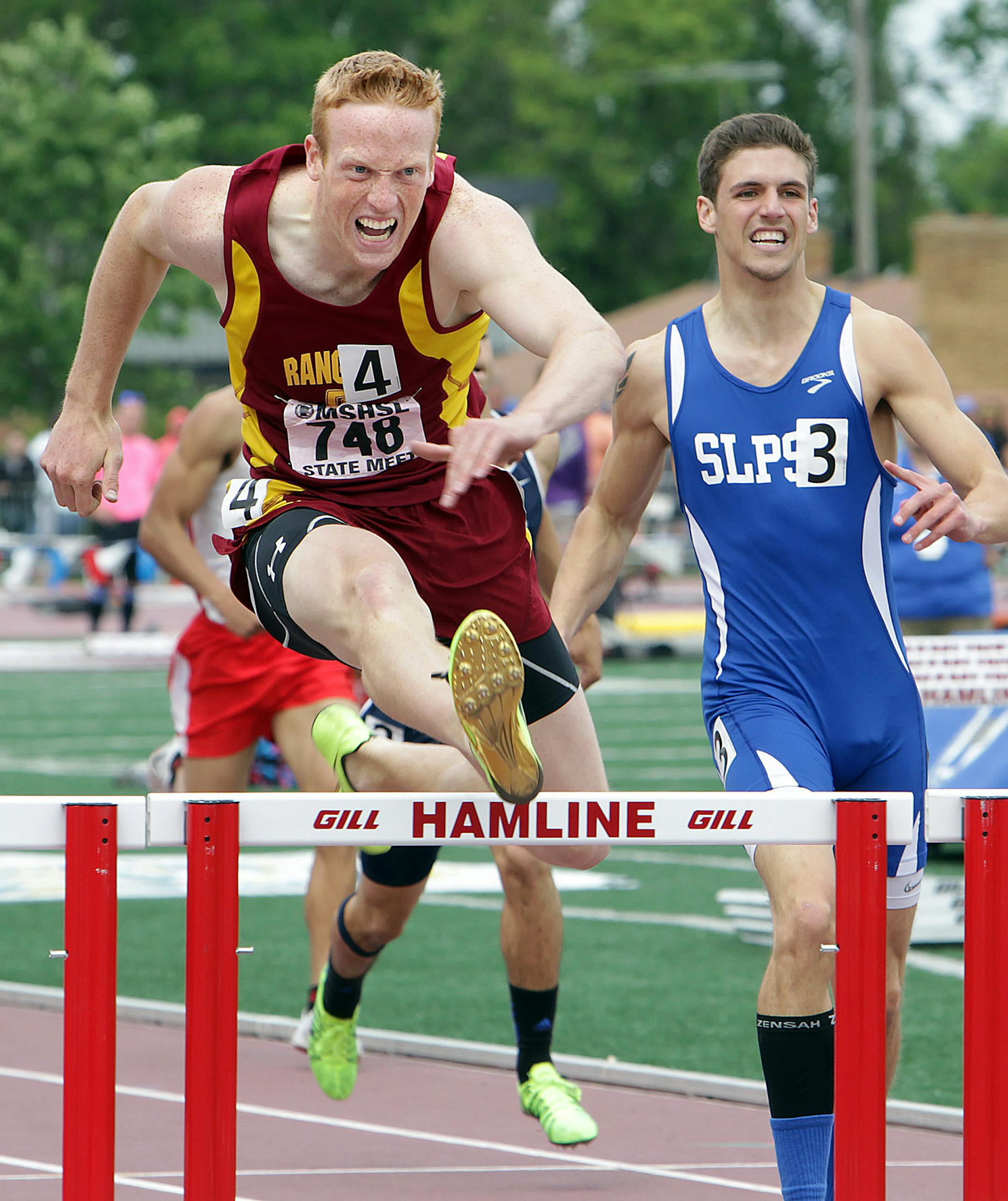 Cody Walton, left, of Forest Lake took first place in the Class 2A boys 300-meter intermediate hurdles at the 2013 State Track and Field Meet at Hamline University in St. Paul June 8, 2013. (Courtney Perry/Special to the Star Tribune)