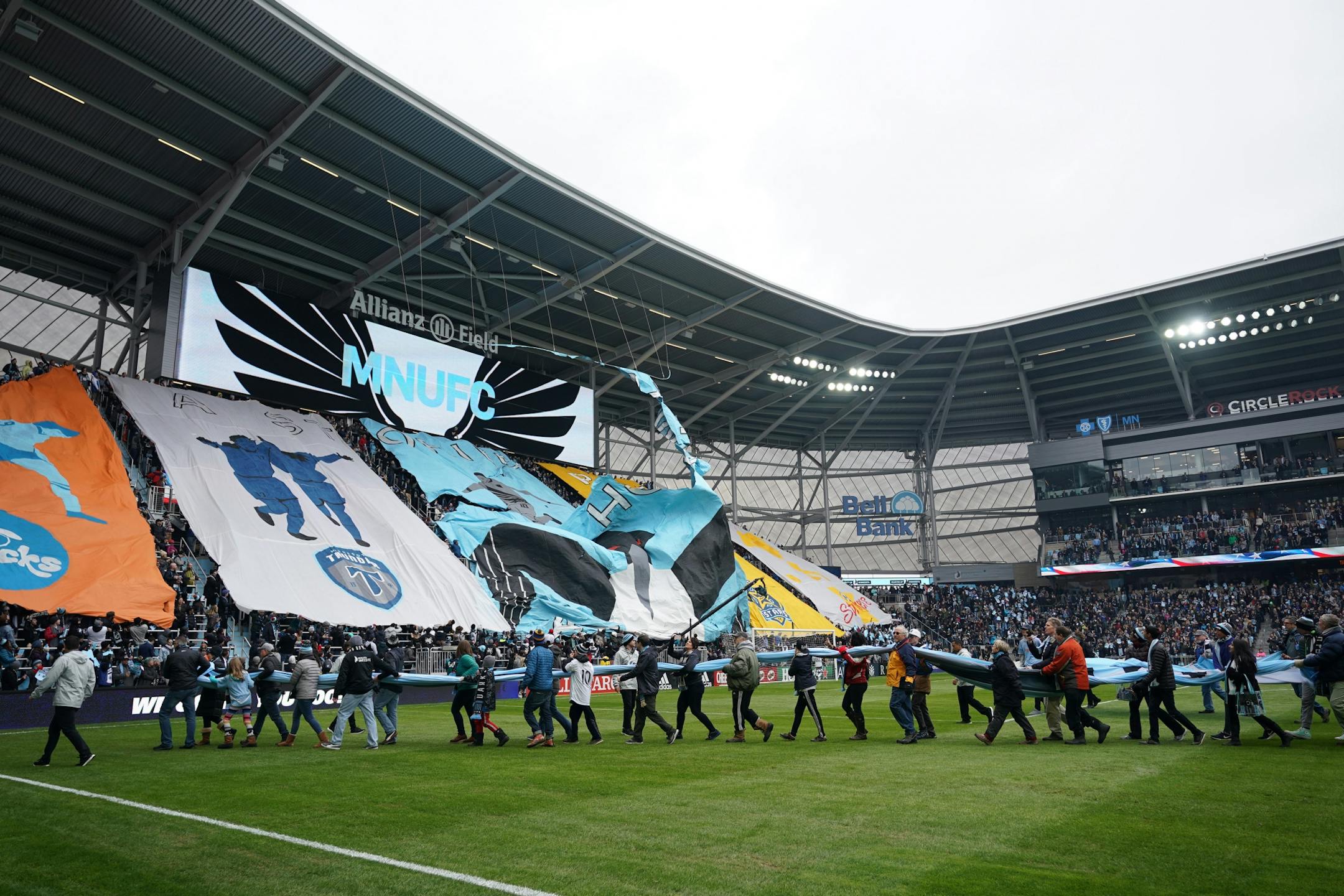Fans carried a massive Minnesota United flag off the field as the Tifo being hoisted by fans ripped ahead of Saturday's Minnesota United home opener against New York City at Allianz Field.