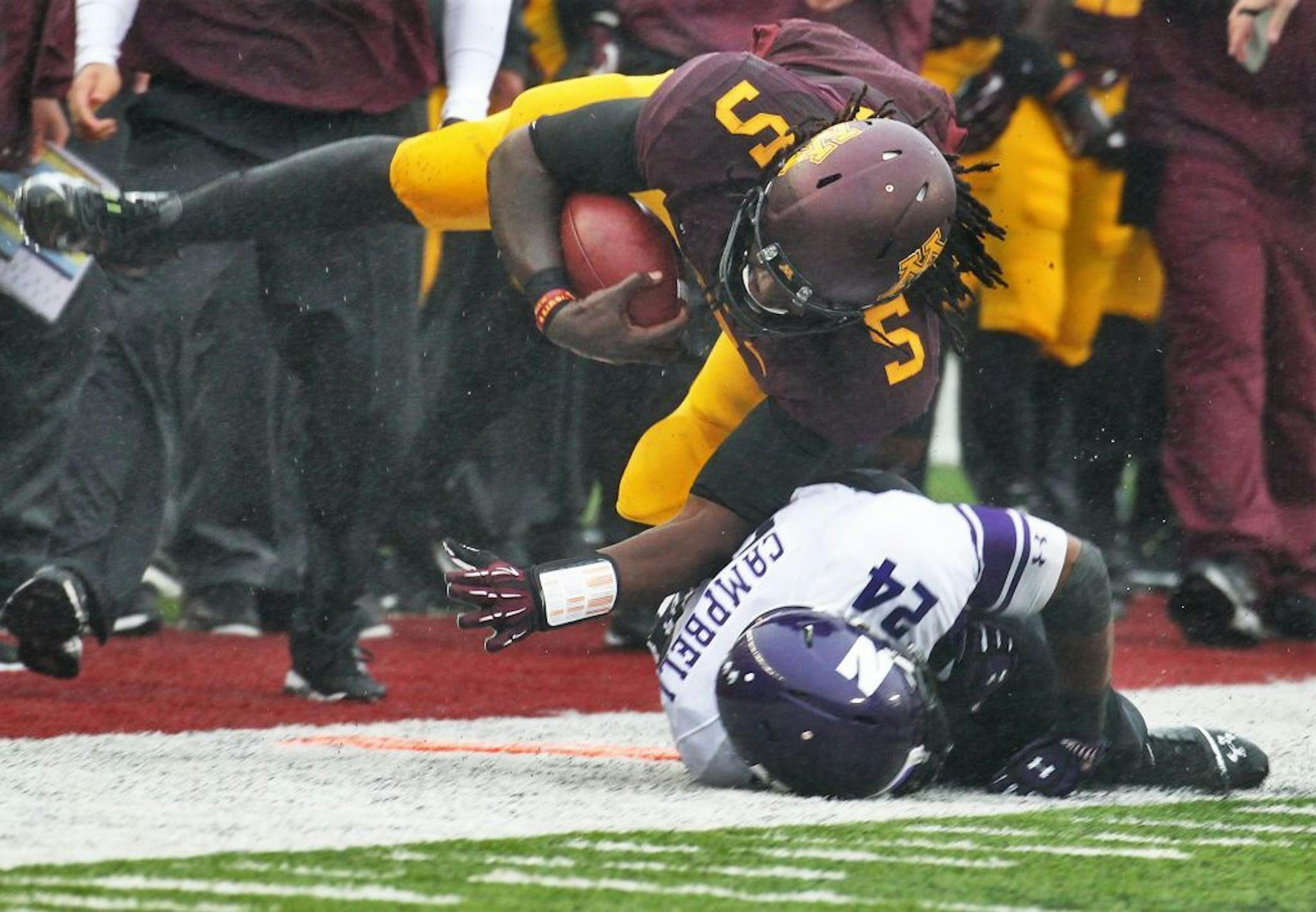 MarQueis Gray injured an ankle and was force to leave the game after this sideline tackle by Northwestern's Ibraheim Campbell.