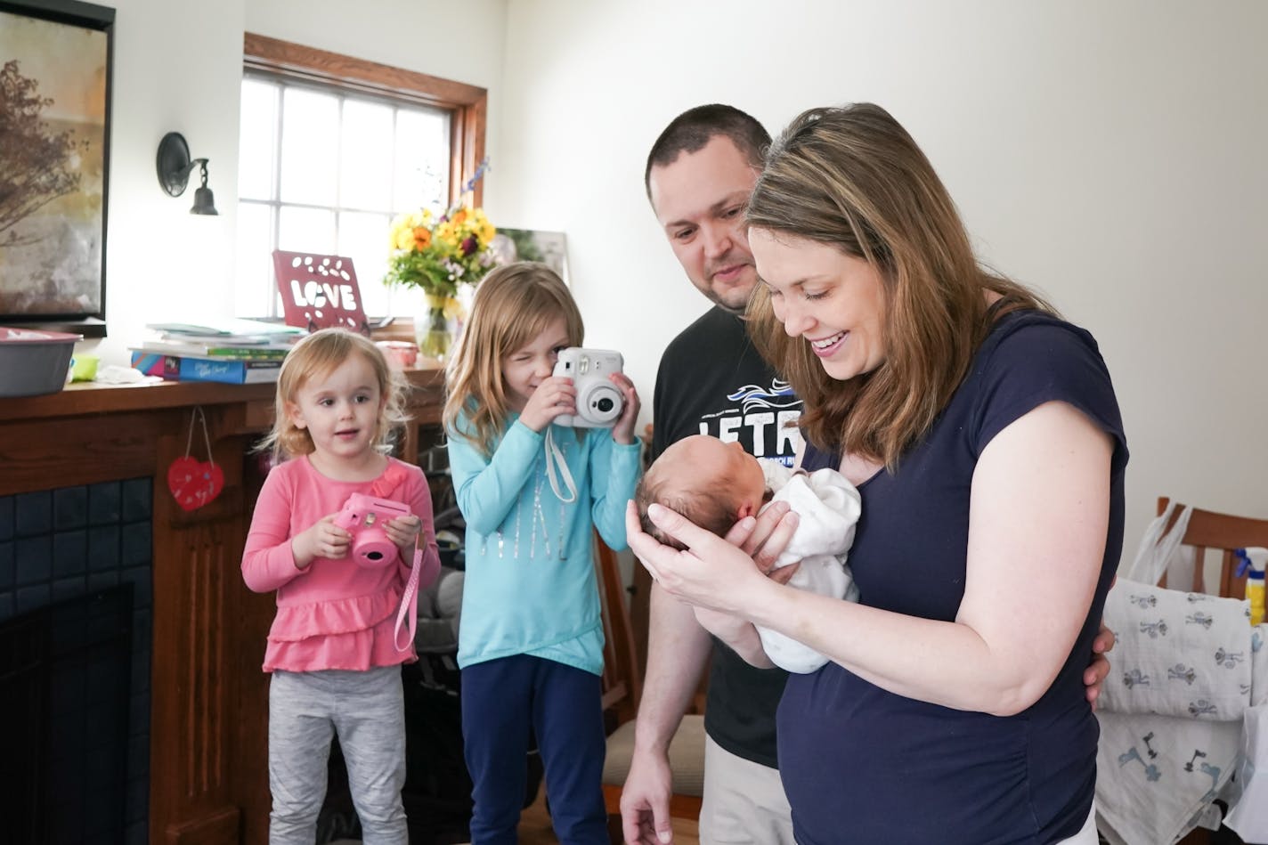 Cassie Bonstrom's baby girl, Harley Sue, was born Saturday. She's shown here with her husband Joel and their other two daughters Mack, 3 and Maddie, 5.