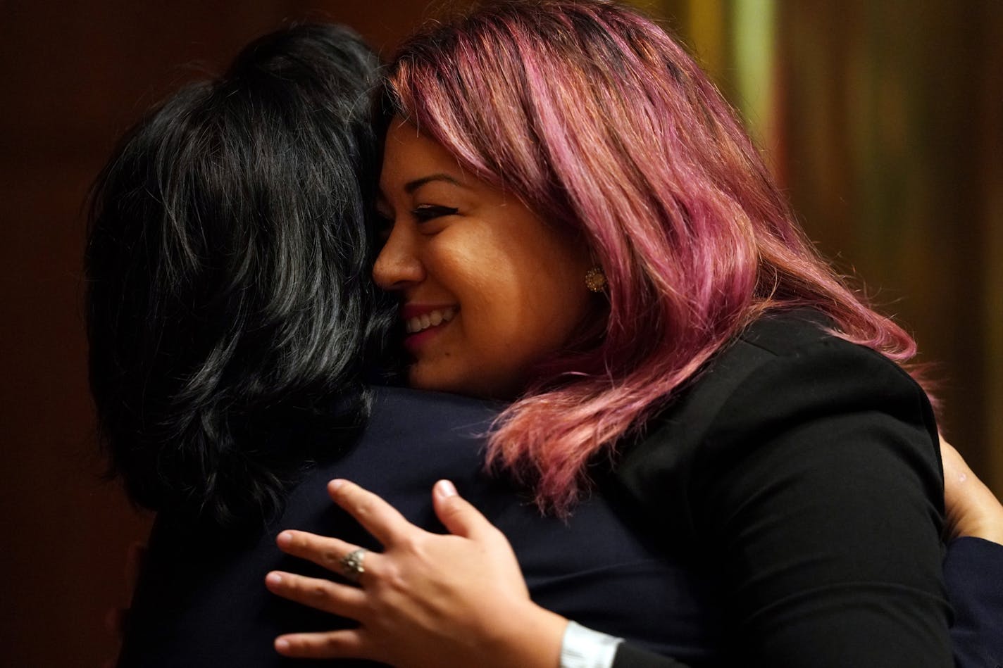 New city council member Mitra Jalali Nelson hugged her mother Sooki Jalali after taking the oath of office at St. Paul City Hall.