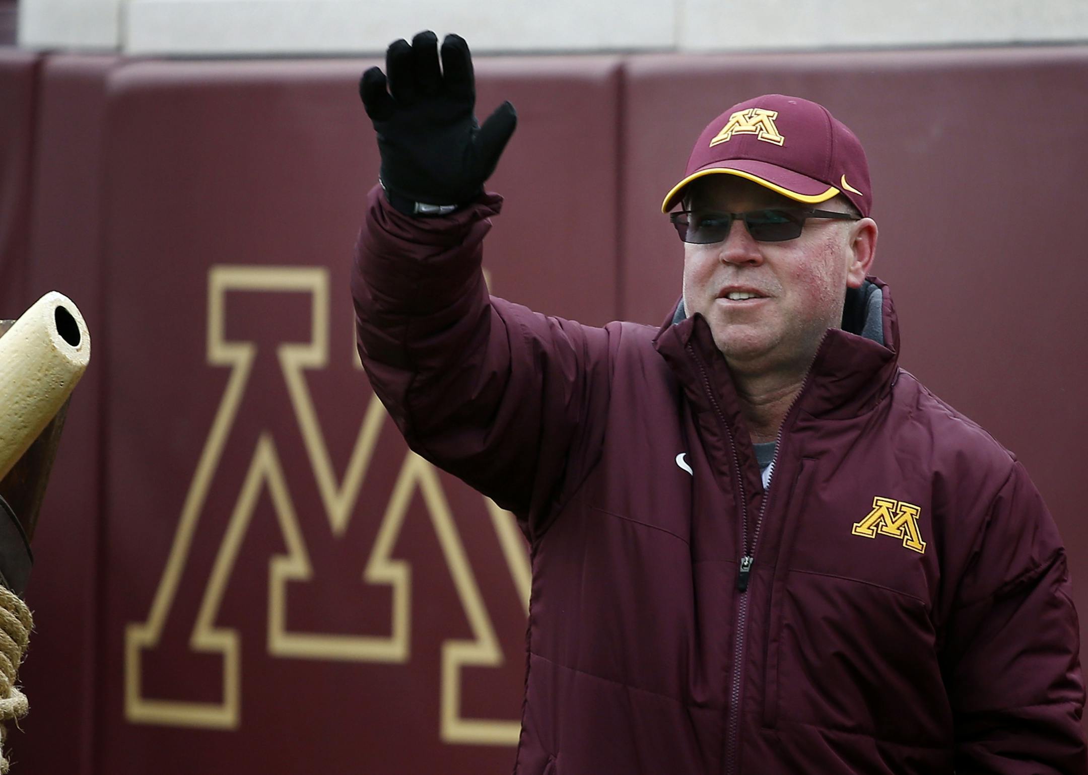 Minnesota Gophers head football coach Jerry Kill waved to the crowd before blowing the horn at Sunday's Vikings game.