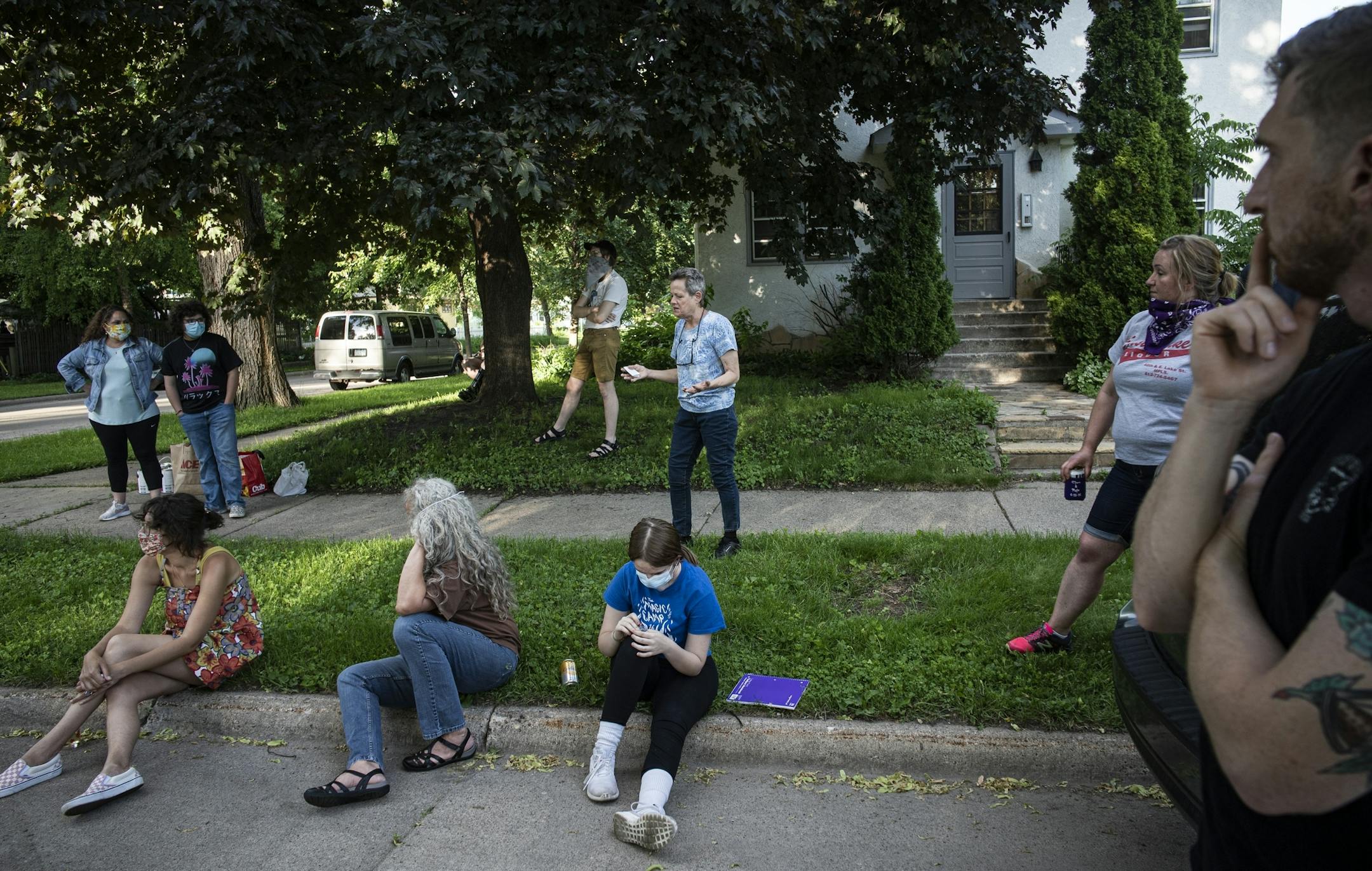 Madeline Clive discusses with fellow block members on how to proceed with the night patrols. Because things have calmed down, they voted to stop them.