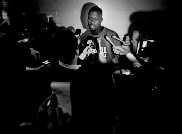 Wolves player J.R. Rider speaks to reporters in a hallway outside of the team's Target Center lock room in 1994.