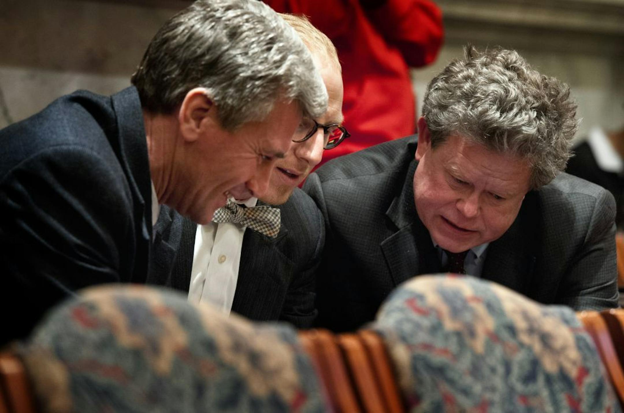 Minneapolis Mayor R.T. Rybak conferred with his chief of staff Jeremy Hanson Willis, center and Chuck Lutz, deputy director for the city's Community Planning and Economic Development (CPED) department during a break January 26, 2012. Mayor Rybak presented the new stadium proposal to the city council today.