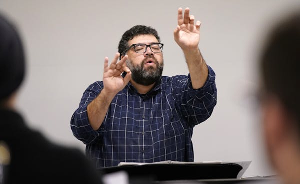 Conductor Ahmed Anzaldúa led the BorderCrosSing rehearsal Monday.