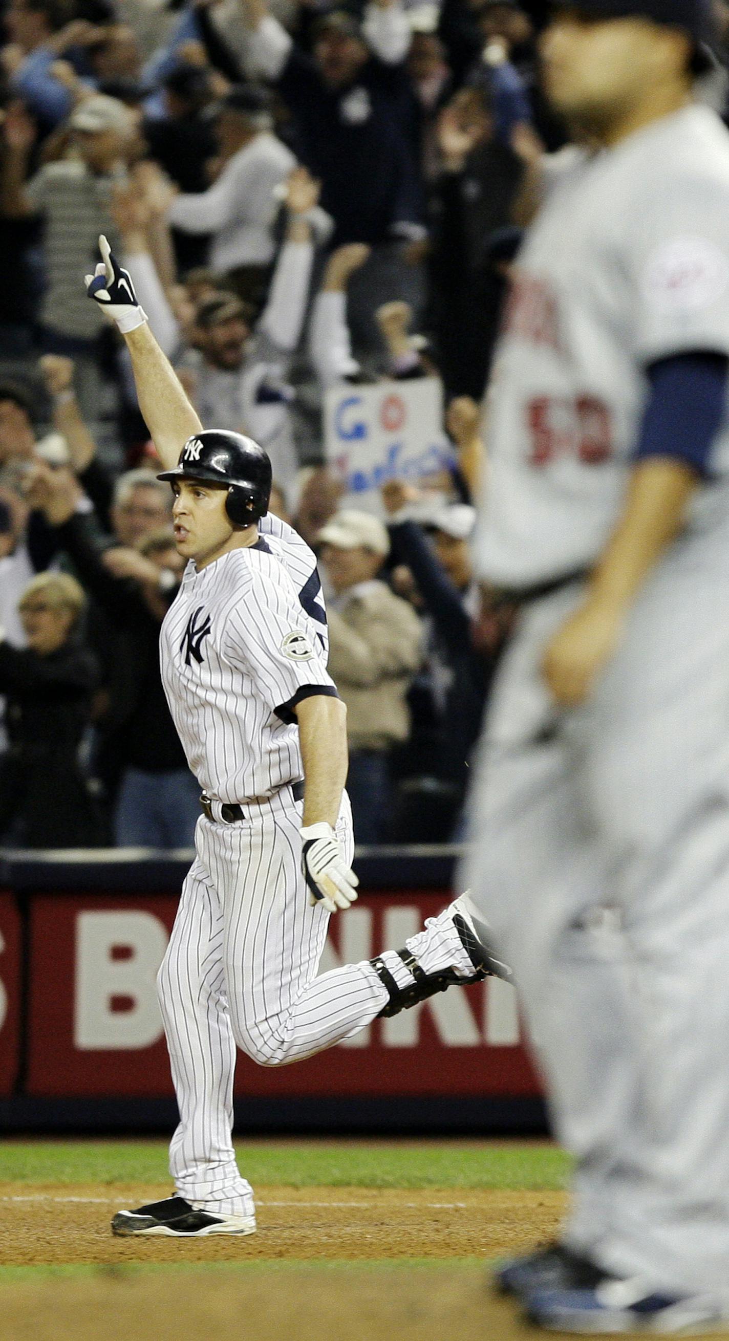 Minnesota Twins relief pitcher Jose Mijares, right, watches as New York Yankees Mark Teixeira celebrates after hitting the game winning home run in the 11th inning of Game 2 of the American League division baseball series at Yankee Stadium in New York Friday, Oct. 9, 2009. (AP Photo/Julie Jacobson) ORG XMIT: NYY1