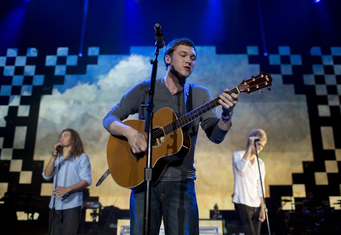 The American Idols LIVE! Tour 2012 stopped by Target Center in Minneapolis Monday night, July 9, 2012. American Idol winner Phillip Phillips was joined by Deandre Brackensick, left, and Colton Dixon on his own song, "Home."