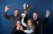 Castle Danger brewery owners (from left) Clint MacFarlane, Jamie MacFarlane, Mandy Larson and Lon Larson hoisted the trophy.