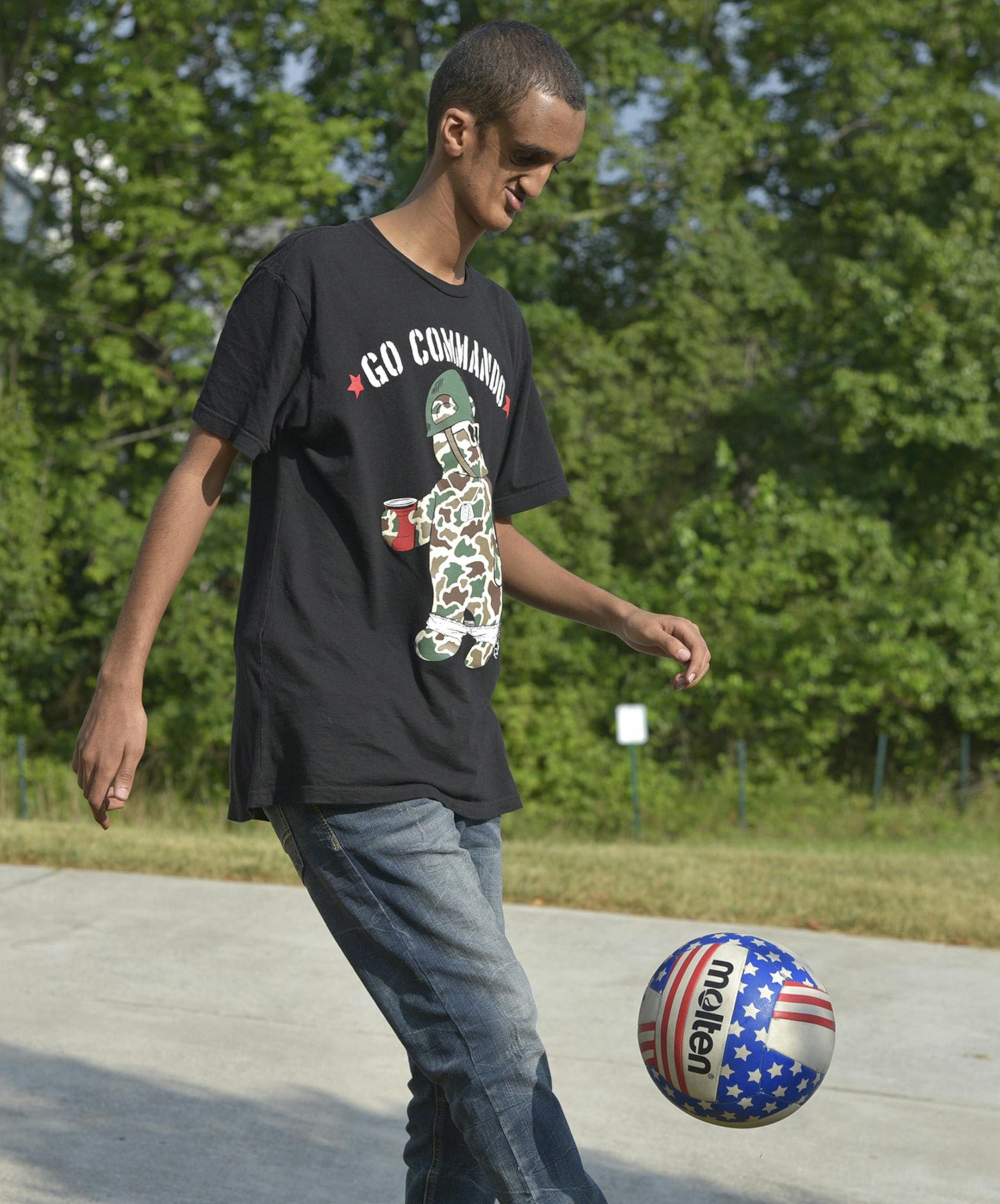 Filmon Haile, from Asmara, the capital city of Eritrea, in east Africa, juggles a soccer ball at the home of his sponsor, Mike Naizghi, on July 30, 2015 in Bowie, Md. (Matthew Cole/Capital Gazette/Baltimore Sun/TNS)