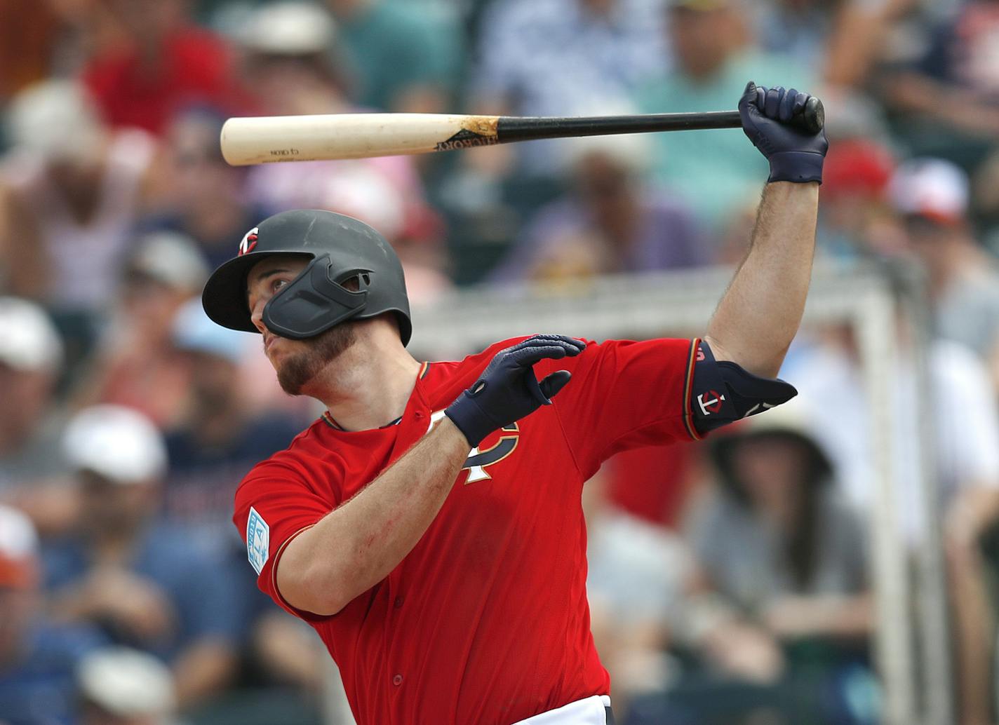 Minnesota Twins first baseman C.J. Cron follows through on a two-run home run in the third inning of a spring training baseball game against the Baltimore Orioles Monday, March 4, 2019, in Fort Myers, Fla. (AP Photo/John Bazemore)