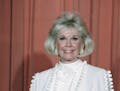 FILE - In this Jan. 28, 1989 file photo, actress and animal rights activist Doris Day poses for photos after receiving the Cecil B. DeMille Award she 