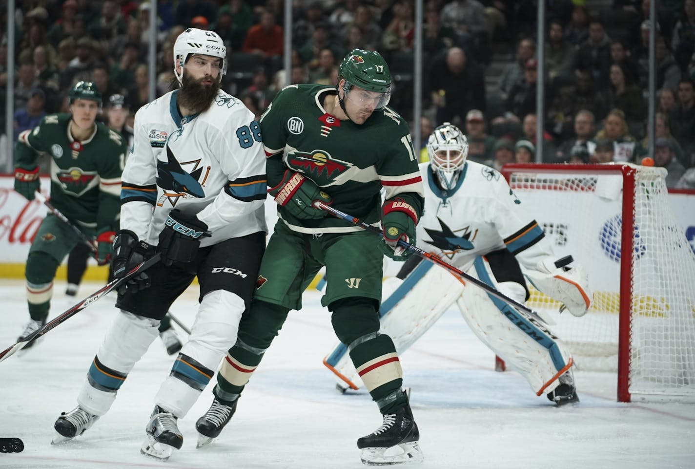 Minnesota Wild left wing Marcus Foligno (17) eyed an incoming puck in the second period while the San Jose Sharks' Brent Burns (88) defended.