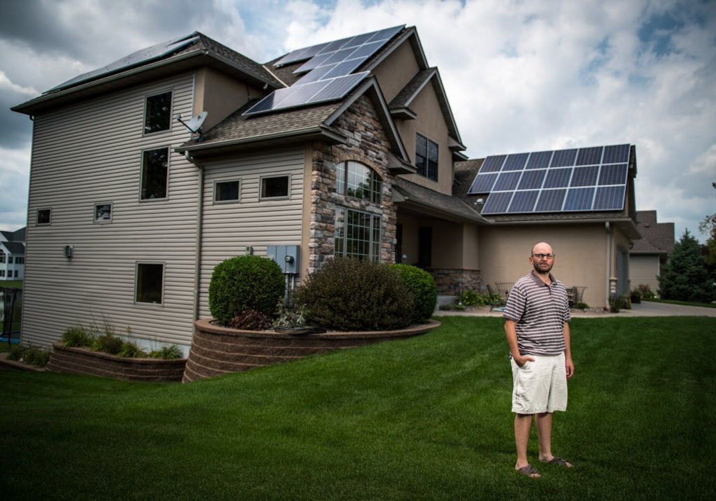 Sam Villella of Blaine has a solar garden on his roof and wants to add more panels, but a new electric co-op fee is holding him back.