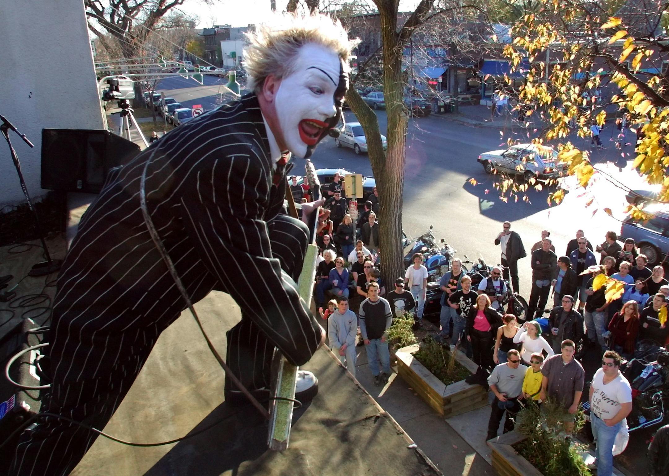 Brynn arens, lead vocal and guitar player for rock band Flipp plays to the crowd gathered on Lyndale Ave. in Minneapolis as the band plays a set from the roof of Bob's Java Hut.