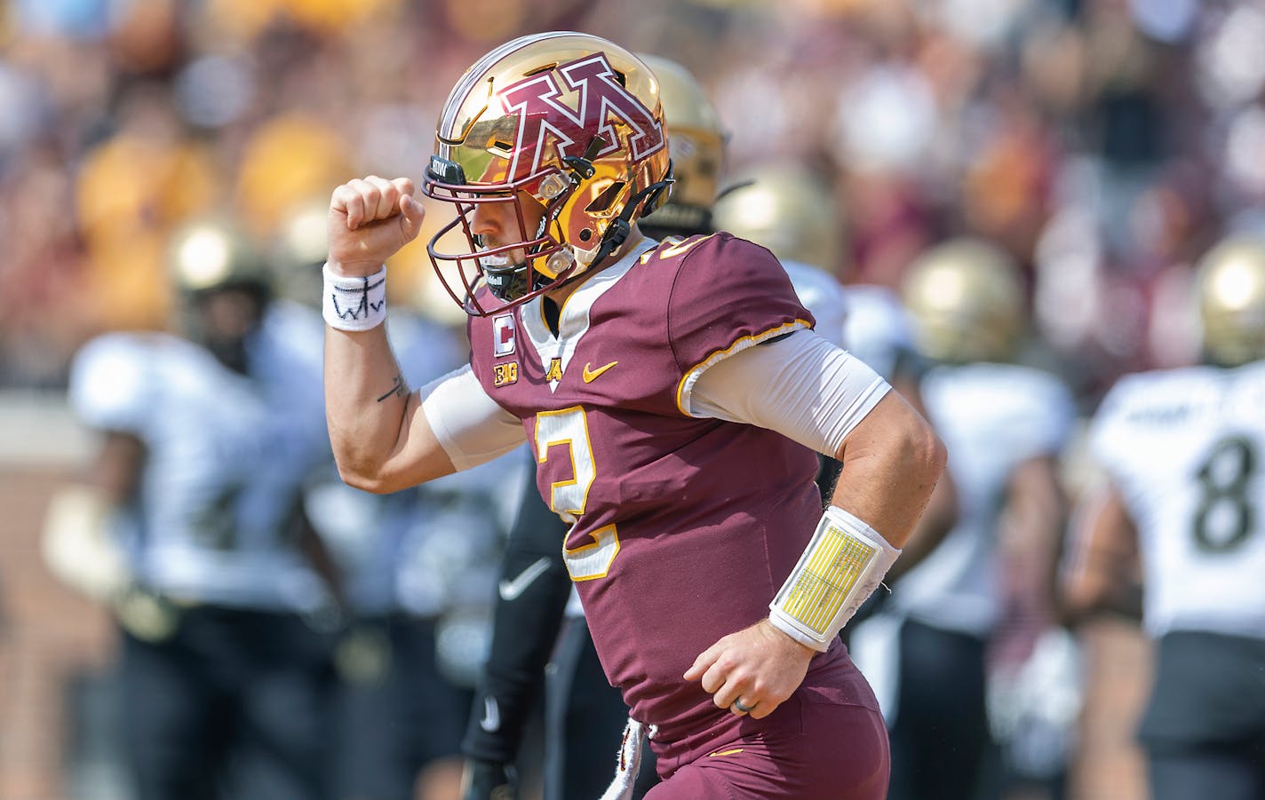 Minnesota's quarterback Tanner Morgan (2) punches his fist as he celebrates the first touchdown in the first quarter against Colorado at Huntington Bank Stadium in Minneapolis, Minn., on Saturday, Sept. 17, 2022. ] Elizabeth Flores • liz.flores@startribune.com