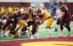 6-9 foot, 400-pound Daniel Faalele (78) rumbled into the endzone for a Gopher maroon touchdown in the second quarter. ] Shari L. Gross &#x2022; shari.