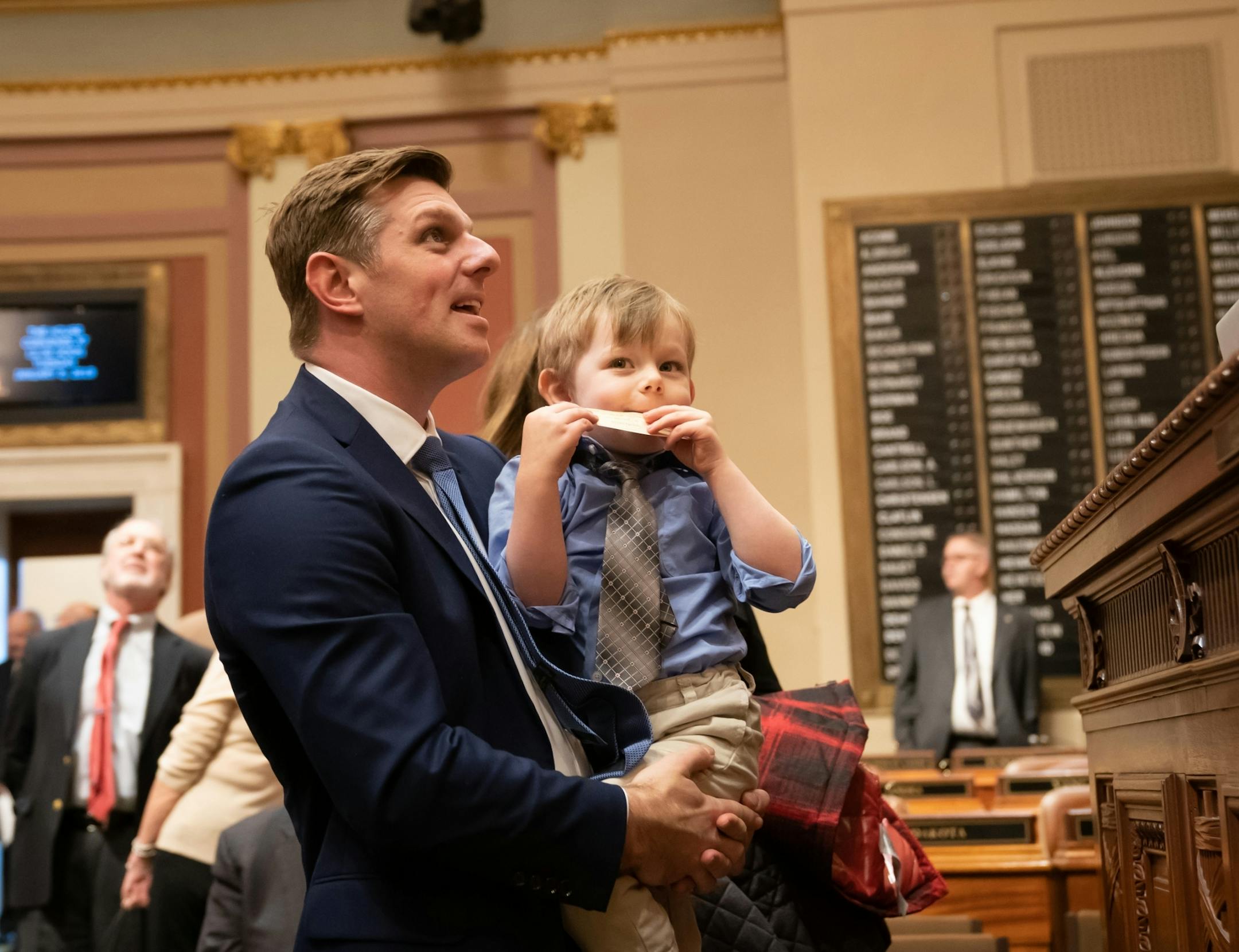 New State Rep. Michael Howard, DFL-Richfield, held his son Calvin, 3 on the House Floor.