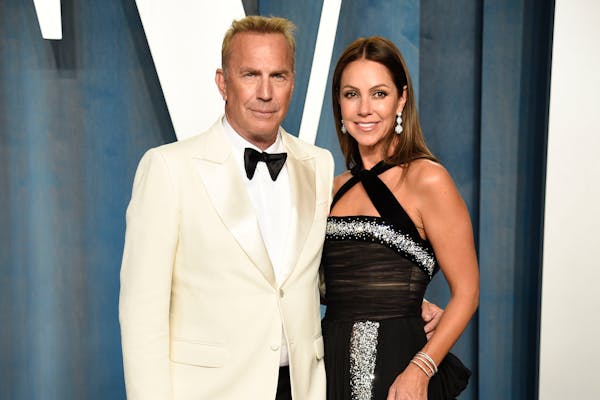 Kevin Costner, left, and Christine Baumgartner arrived at the Vanity Fair Oscar Party, March 27, 2022, in Beverly Hills, Calif. A judge has declared t