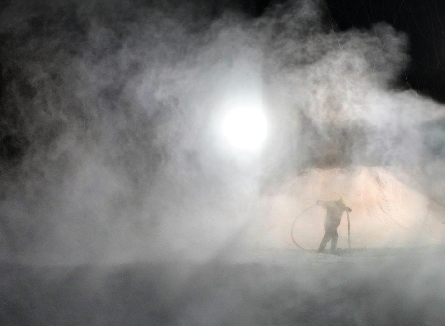 After the last skier had left the hill for the night, the crew at Hyland Hills Ski area in Bloomington got busy making more snow throughout the night. Here, Travis Peterson pulls a water hose out of a man-made blizzard at the top of Big Moe run. ]
brian.peterson@startribune.com
Bloomington, MN
Tuesday, January 7, 2020