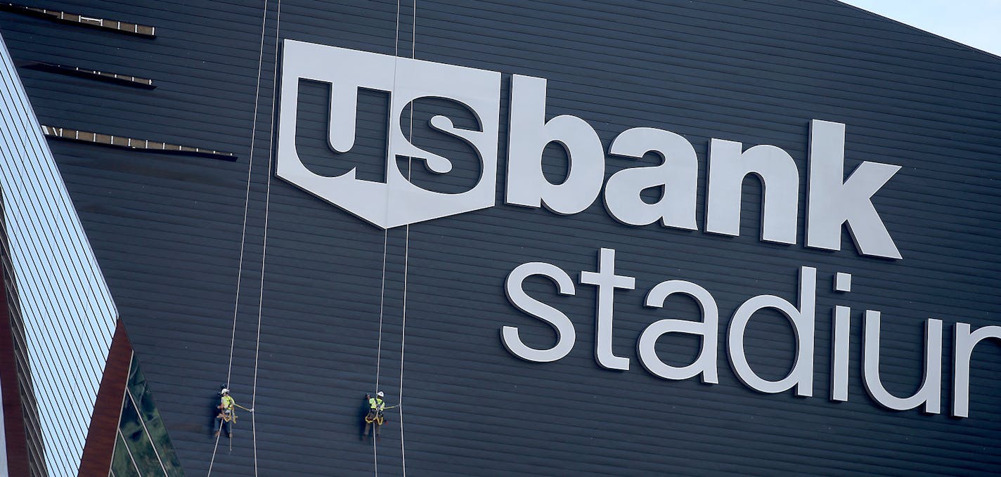 Construction crew worked on panels that were coming off on the side of the US Bank Stadium on July 6, 2016, in Minneapolis.