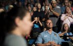 Minneapolis police officer Michael Osbeck looked towards the court as the Lynx's starting lineup is announced.