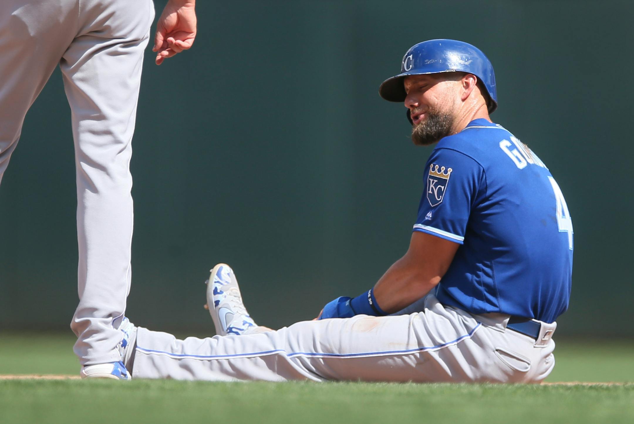Kansas City Royals' Alex Gordon remains seated for a few moments after he was caught stealing in the seventh inning of a baseball game against the Minnesota Twins, Sunday, Aug. 4, 2019, in Minneapolis. (AP Photo/Jim Mone)