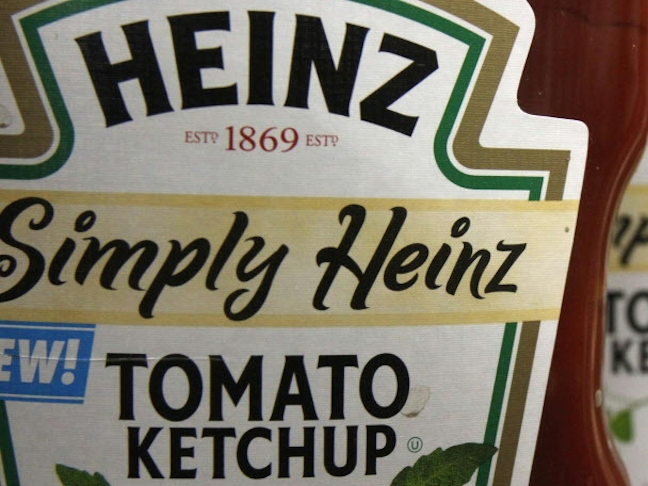 FILE - This March 2, 2011, file photo, shows containers of Heinz ketchup on the shelf of a market, in Barre, Vt. In 2015, Kraft Heinz announced it is cutting about 2,500 jobs as part of its plan to slash costs after the food companies combined. (AP Photo/Toby Talbot, File)