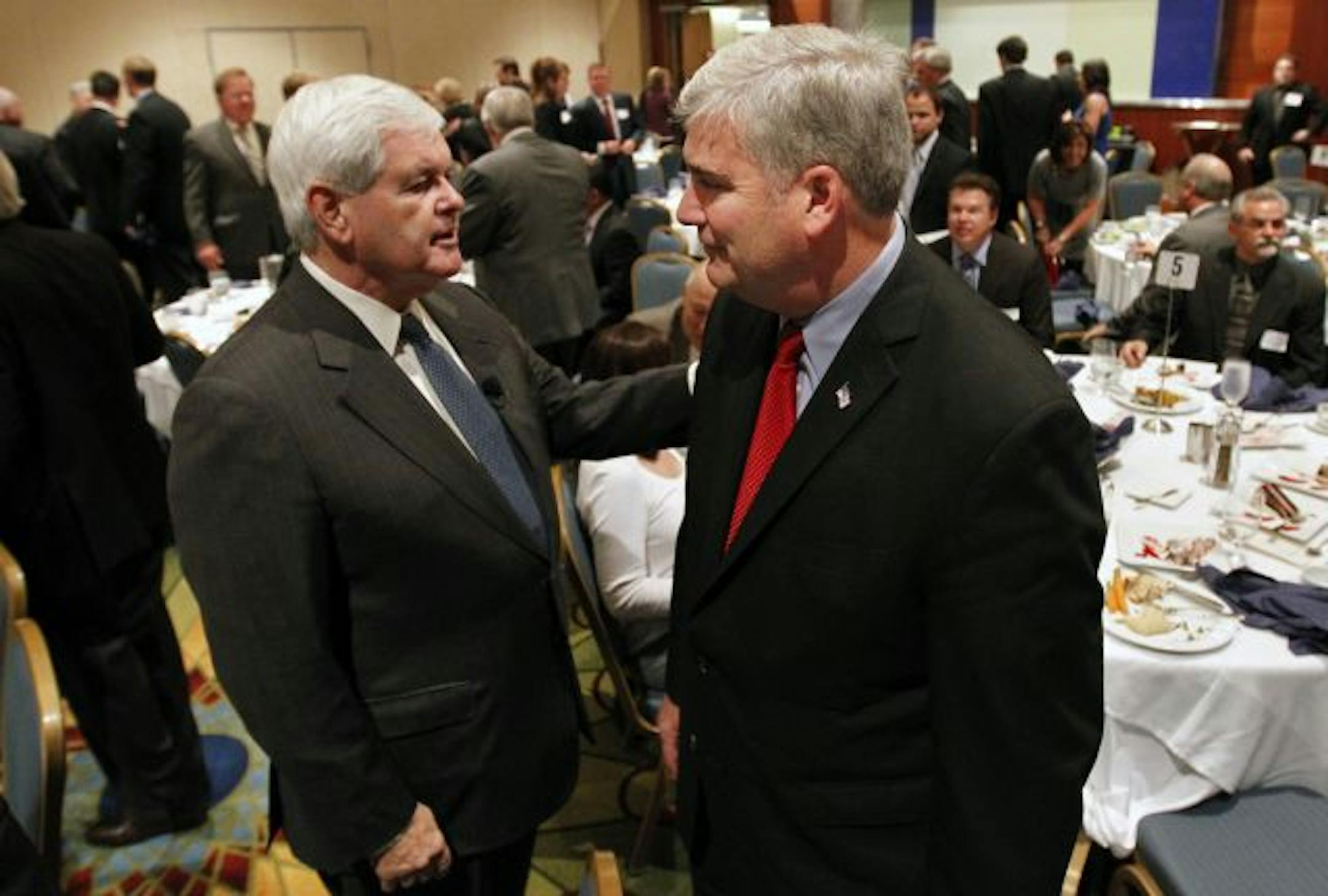 Former House Speaker Newt Gingrich, left, raised money Wednesday for GOP gubernatorial candidate Tom Emmer and running mate Annette Meeks, who was once a Gingrich aide. Their ticket is "dedicated to lower taxes and more jobs and more take-home pay," Gingrich said.