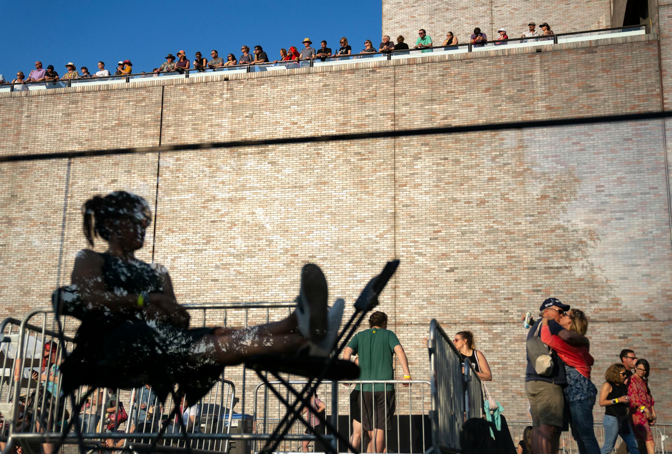 Spectators listen as Sleater-Kinney performs during Rock the Garden.
