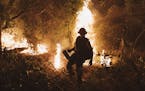 Firefighters light backfires at the Bobcat Fire at Santa Anita Canyon in Arcadia, Calif., Sunday, Sept., 13, 2020. Wildfires across the West Coast hav