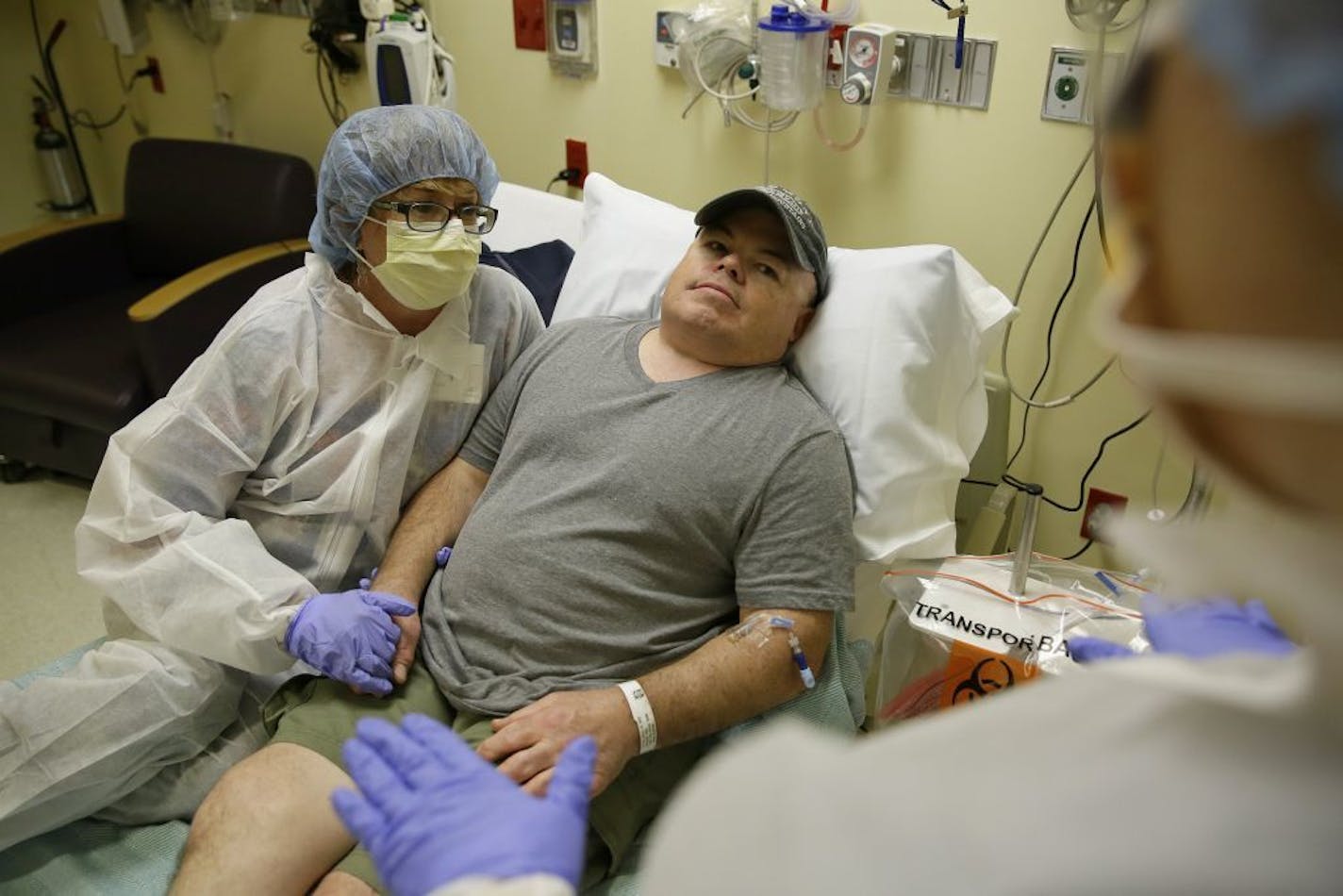 Brian Madeux, 44, sitting with his girlfriend Marcie Humphrey, waits to receive the first human gene editing therapy for NPS, at the UCSF Benioff Children's Hospital in Oakland, Calif., on Monday, Nov. 6, 2017. Madeux, who has a metabolic disease called Hunter syndrome, will receive billions of copies of a corrective gene and a genetic tool, through an IV, to cut his DNA in a precise spot.