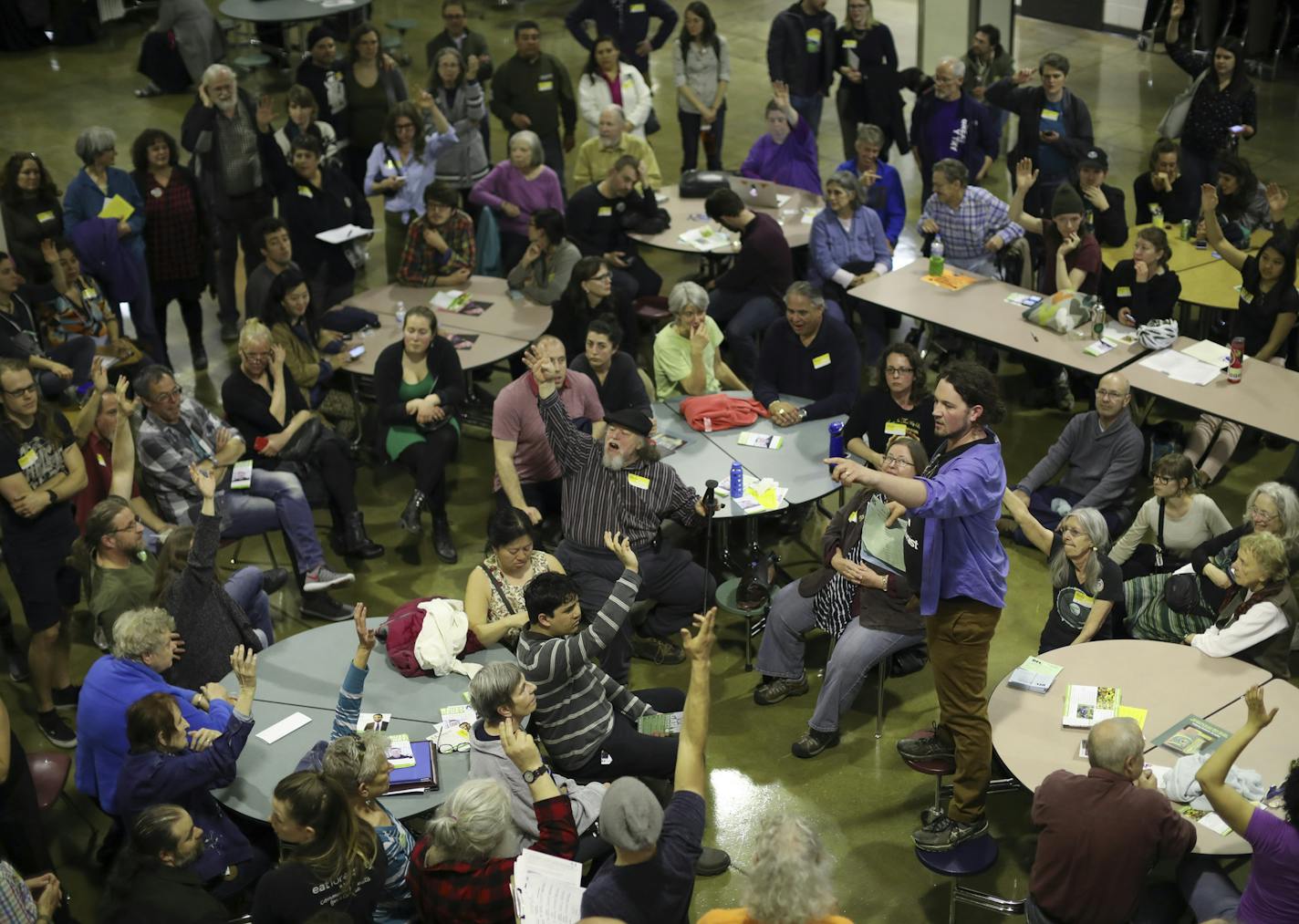 Aaron Spading, 2nd Precinct chair, was running a caucus for his first time. He asked for a show of hands of those in attendance who were interested in attending the city convention in July. Minneapolis DFLers caucused for City Council, Park Board and mayoral races in Ward 9 at South High School and elsewhere around the city Tuesday evening, April 4, 2017. So many people attended the Precinct 2 caucus that they had to move the caucus from a classroom to the school cafeteria at South.