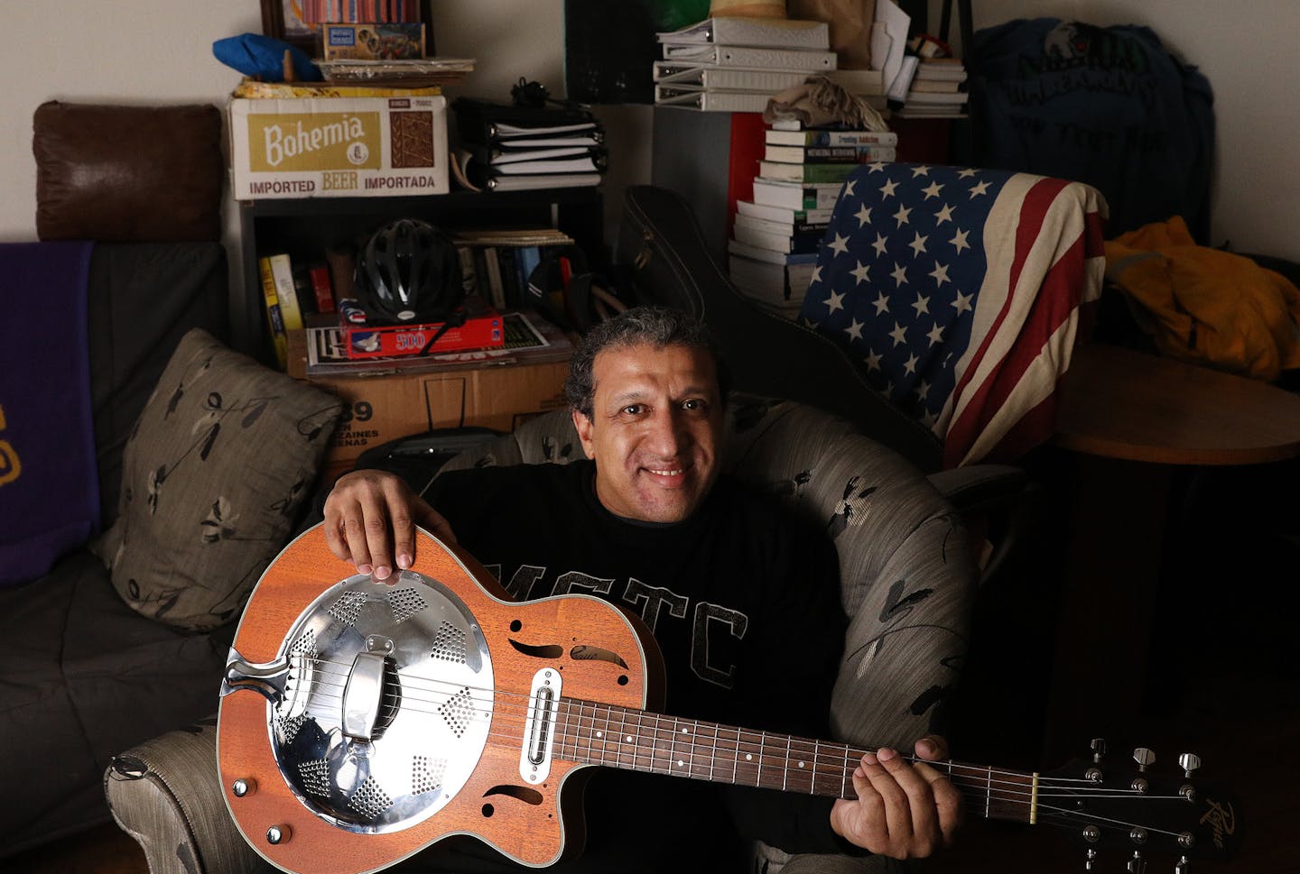 Jimmie Bishop, who was once homeless but now lives in an apartment provided by the Hennepin County Medical Center, sat for a portrait at his place Monday. Bishop also plays the guitar as form of musical therapy. ] ANTHONY SOUFFLE &#x2022; anthony.souffle@startribune.com Jimmie Bishop, who was once homeless but now lives in an apartment provided by the Hennepin County Medical Center, sat for a portrait Monday, Dec. 19, 2016 at his place in Minneapolis. The program, which provides housing and soci