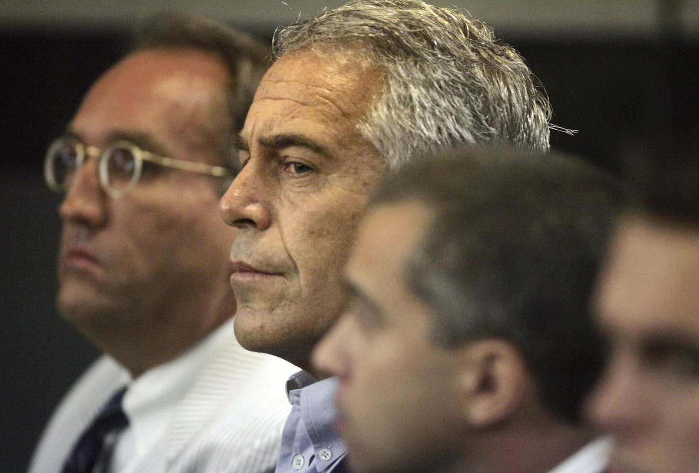 FILE - In this July 30, 2008, file photo, Jeffrey Epstein, center, appears in court in West Palm Beach, Fla. At the center of Epstein's secluded New Mexico ranch sits a sprawling residence the financier built decades ago, complete with plans for a 4,000-square-foot (372-square-meter) courtyard, a living room roughly the size of the average American home and a nearby private airplane runway. Known as the Zorro Ranch, the high-desert property is now tied to an investigation that the state attorney