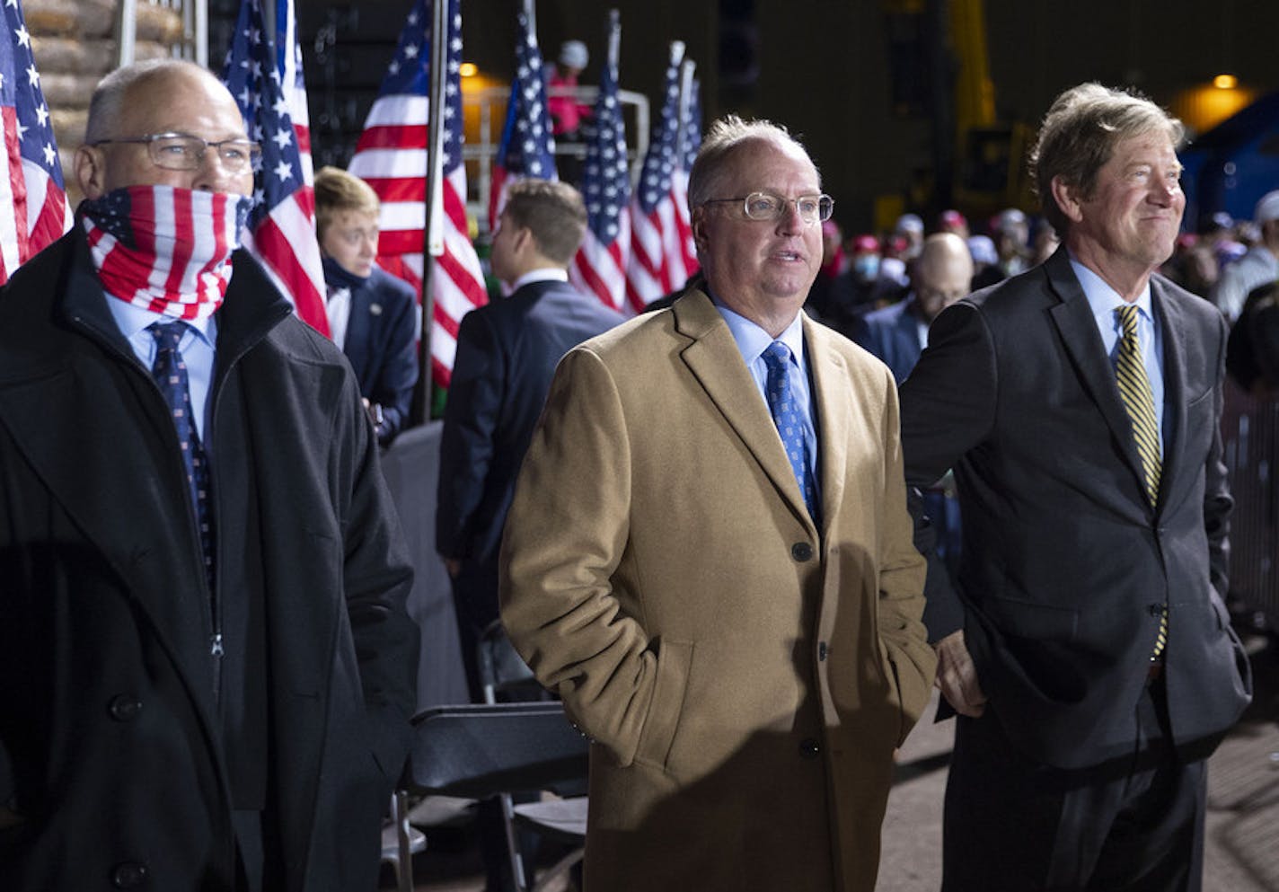 (From left) U.S. Represntatives Pete Stauber, Jim Hagedorn and senate candidate Jason Lewis stood off stage left during President Trump's remarks at Duluth International Airport on Wednesday night. The president tested positive for COVID-19 just over 24 hours later. ] ALEX KORMANN • alex.kormann@startribune.com President Trump visited Duluth on Wednesday September 30, 2020 as one of multiple campaign stops in Minnesota that day. The President spoke at Duluth International Airport starting around